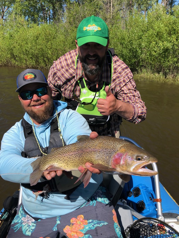 Trent and Ryan Herbert of Yampa Valley Anglers, LLC and a stud Rainbow