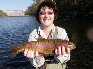 The White River Inn, Woman trout fishing on the White River in Arkansas.