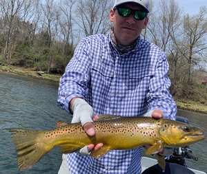 The White River Inn, Man trout fishing on the White River in Arkansas.