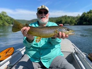 The White River Inn, Man trout fishing on the White River in Arkansas.