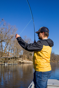 The White River Inn, Man trout fishing on the White River in Arkansas.