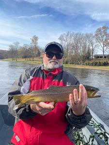 The White River Inn, Man trout fishing on the White River in Cotter, Arkansas