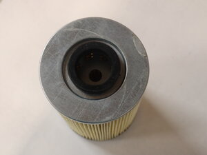 hydraulic cartridge in canister in front of fuel tank